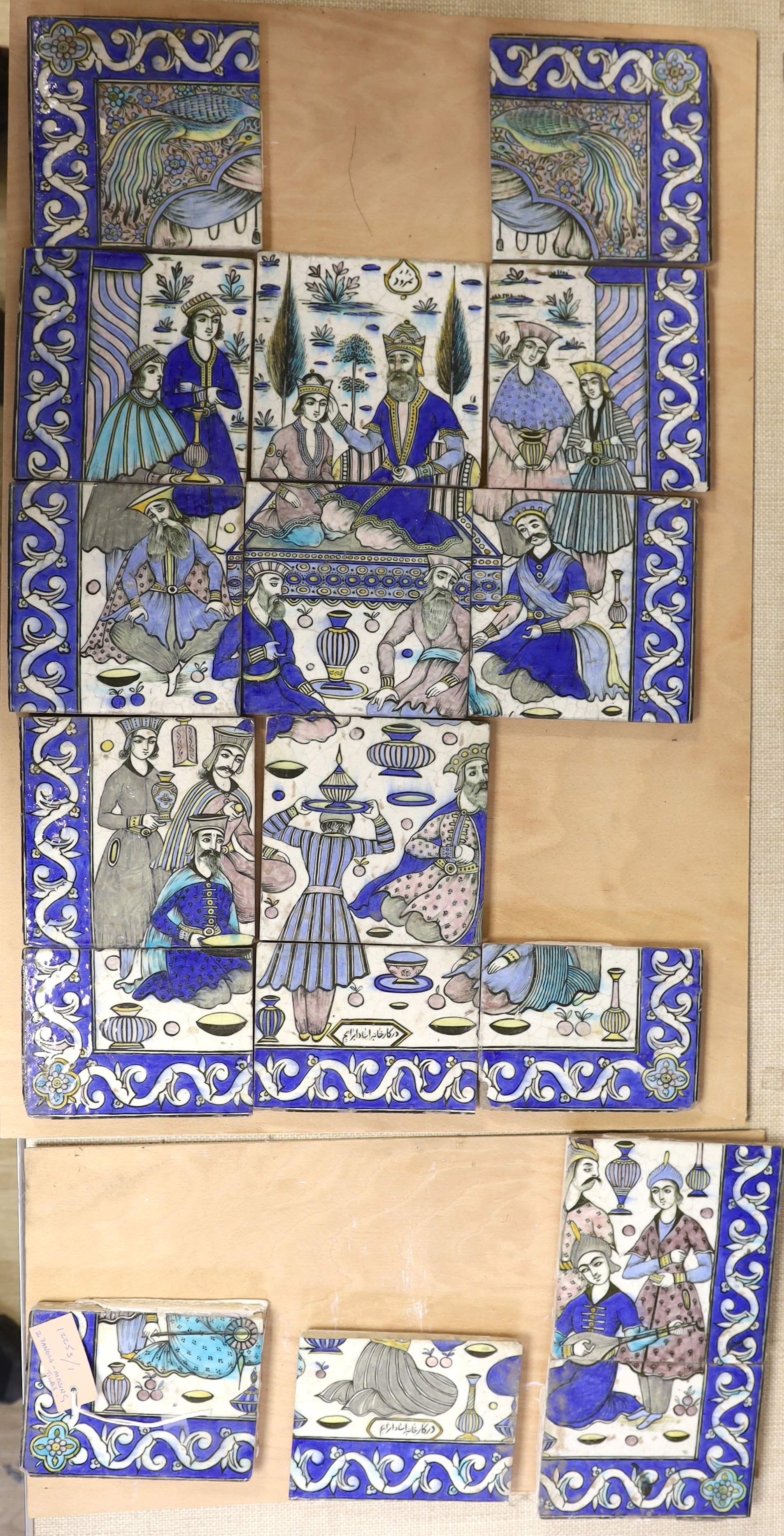 A collection of 20th century Persian tiles as a figurative panel, (two tiles missing) together with four other others from a similar panel, larger panel approximately 86.5cm high x 45cm wide